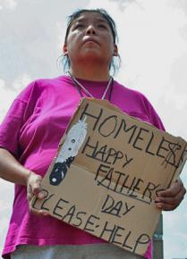 A Native American woman asks for donations near Minneapolis